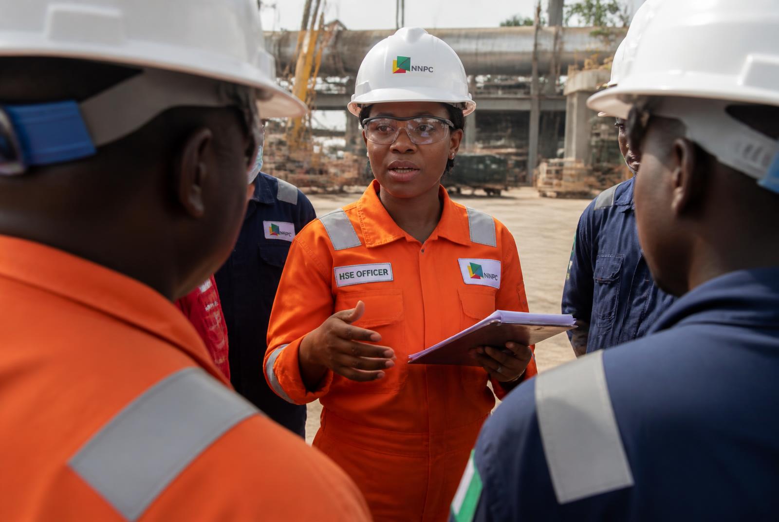 HSE officer conducting a safety briefing on a Nigerian industrial site